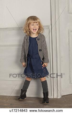 Smiling girl shouting indoors View Large Photo Image Stock Image - Smiling girl shouting indoors. Fotosearch