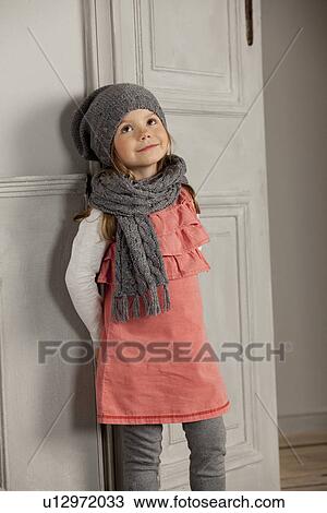 Smiling girl wearing hat and scarf View Large Photo Image Stock Image - Smiling girl wearing hat and scarf. Fotosearch