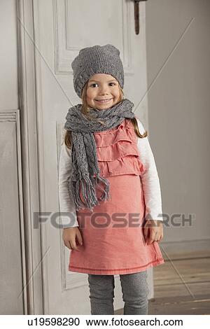 Smiling girl wearing hat and scarf View Large Photo Image Stock Image - Smiling girl wearing hat and scarf. Fotosearch