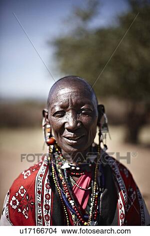 Smiling Maasai woman wearing jewelry View Large Photo Image Picture - Smiling Maasai woman wearing jewelry. Fotosearch