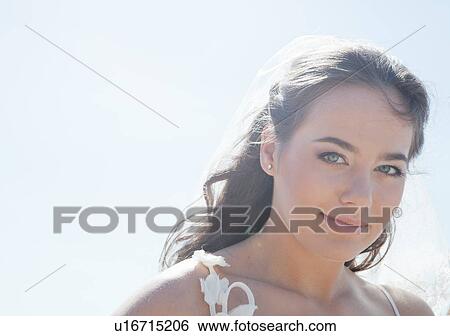 Stock Photograph - Smiling woman standing outdoors. Fotosearch