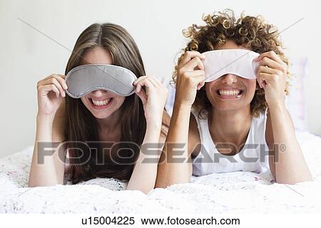 Smiling woman wearing face masks View Large Photo Image Stock Photography - Smiling woman wearing face masks. Fotosearch