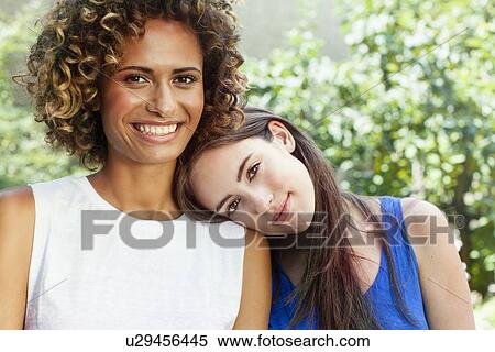 Smiling women sitting together View Large Photo Image Stock Photography - Smiling women sitting together. Fotosearch
