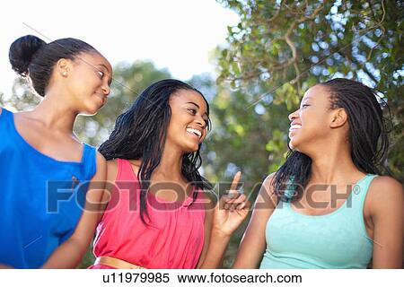 Smiling women walking outdoors View Large Photo Image Stock Photography - Smiling women walking outdoors. Fotosearch