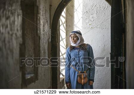 Stock Photo - Student in period dress at castle. Fotosearch