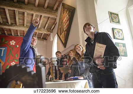 Stock Photograph - Students examining medieval castle. Fotosearch