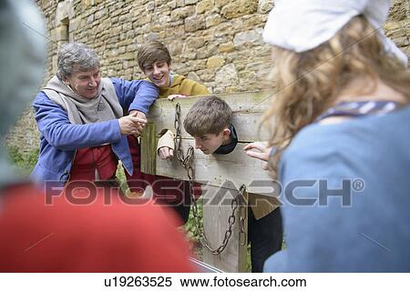 Students examining medieval stocks View Large Photo Image Stock Photography - Students examining medieval stocks. Fotosearch