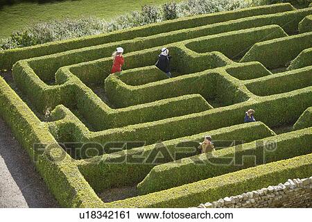 Students exploring hedge maze View Large Photo Image Stock Image - Students exploring hedge maze. Fotosearch