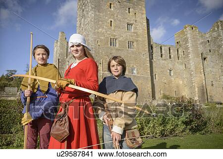 Students in period dress holding weapons View Large Photo Image Stock Image - Students in period dress holding weapons. Fotosearch