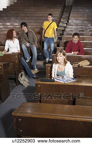 Students lounging in classroom View Large Photo Image Stock Image - Students lounging in classroom. Fotosearch