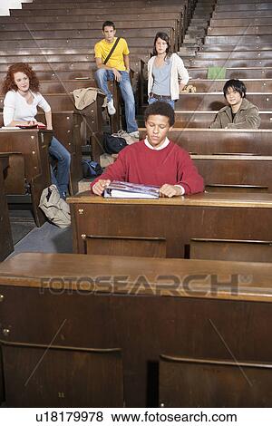Students lounging in classroom View Large Photo Image Stock Photo - Students lounging in classroom. Fotosearch