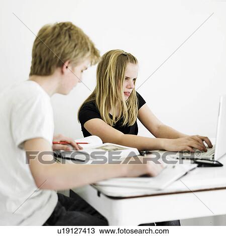 Students working together at table View Large Photo Image Stock Image - Students working together at table. Fotosearch