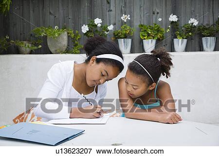 Students working together outdoors View Large Photo Image Stock Photo - Students working together outdoors. Fotosearch