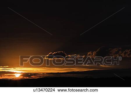 Sun setting over rural landscape View Large Photo Image Picture - Sun setting over rural landscape. Fotosearch