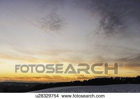 Picture - Sun setting over rural landscape. Fotosearch