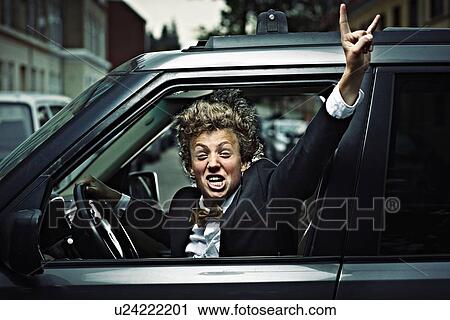 Teenage boy cheering while driving View Large Photo Image Stock Image - Teenage boy cheering while driving. Fotosearch