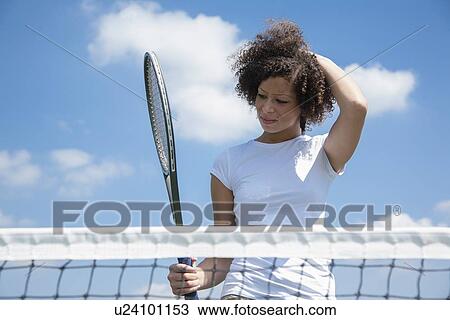 Tennis player with racket on court View Large Photo Image Stock Image - Tennis player with racket on court. Fotosearch