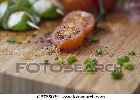 Tomatoes with spices, oil and onions View Large Photo Image Stock Photo - Tomatoes with spices, oil and onions. Fotosearch