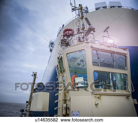 Tugboat towing ship to harbor View Large Photo Image Stock Image - Tugboat towing ship to harbor. Fotosearch