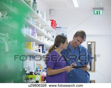 Veterinarians talking in lab View Large Photo Image Stock Photograph - Veterinarians talking in lab. Fotosearch