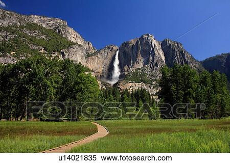 Waterfall over cliff in rural landscape View Large Photo Image Stock Photography - Waterfall over cliff in rural landscape. Fotosearch