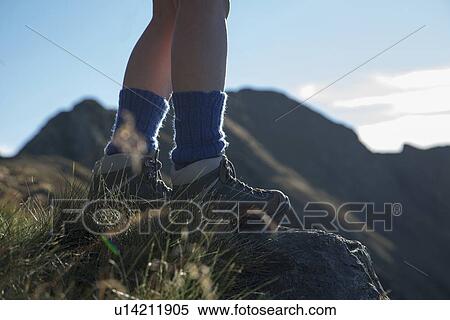 Woman hiking on rural hillside View Large Photo Image Stock Photography - Woman hiking on rural hillside. Fotosearch