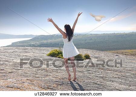 Woman playing on rock formation View Large Photo Image Stock Photo - Woman playing on rock formation. Fotosearch