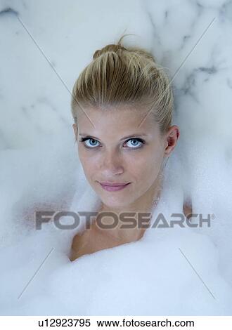Woman relaxing in bubble bath View Large Photo Image Stock Photography - Woman relaxing in bubble bath. Fotosearch