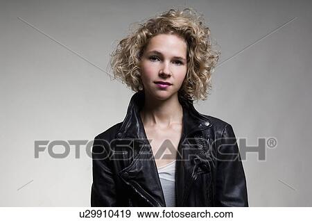 Woman wearing leather jacket View Large Photo Image Stock Photo - Woman wearing leather jacket. Fotosearch