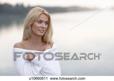 Woman wrapped in towel on lake View Large Photo Image Stock Image - Woman wrapped in towel on lake. Fotosearch