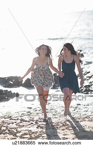 Women running together on beach View Large Photo Image Stock Photography - Women running together on beach. Fotosearch