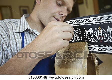 Worker examining weaving in shop View Large Photo Image Stock Photo - Worker examining weaving in shop. Fotosearch