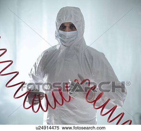 Worker in protective suit holding coils View Large Photo Image Stock Photography - Worker in protective suit holding coils. Fotosearch