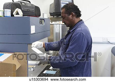 Worker matching paint to swatches View Large Photo Image Picture - Worker matching paint to swatches. Fotosearch