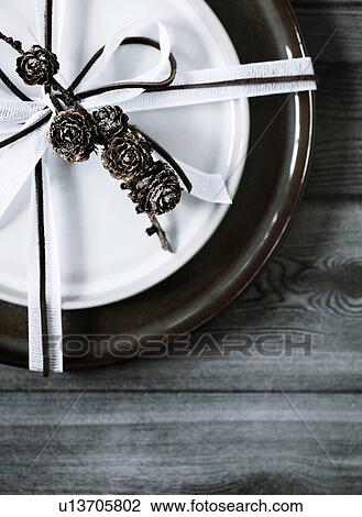 Wrapped plate on wooden table View Large Photo Image Stock Image - Wrapped plate on wooden table. Fotosearch
