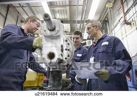 Apprentices learning in car factory View Large Photo Image Picture - Apprentices learning in car factory. Fotosearch