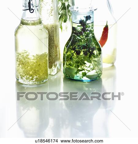 Picture - Bottles of herbed olive oil. Fotosearch