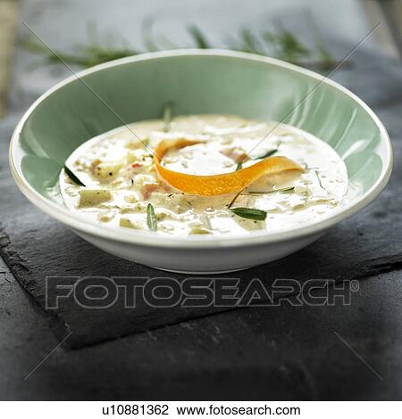 Stock Image - Bowl of soup with citrus peel. Fotosearch