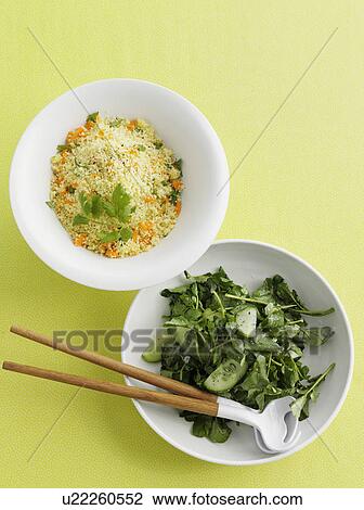 Stock Image - Bowls of couscous and salad. Fotosearch