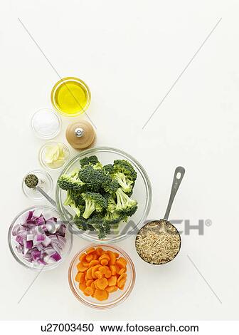 Stock Image - Bowls of vegetables and spices. Fotosearch