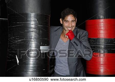 Boxer training with punching bag View Large Photo Image Stock Image - Boxer training with punching bag. Fotosearch