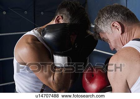 Stock Photo - Boxers sparring in ring. Fotosearch