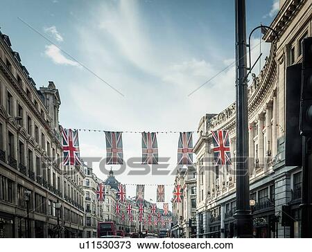 British flags hanging over city street View Large Photo Image Stock Image - British flags hanging over city street. Fotosearch