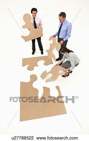 Business people assembling puzzle View Large Photo Image Stock Image - Business people assembling puzzle. Fotosearch