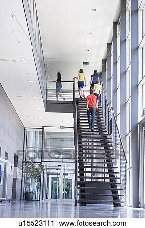 Business people climbing office stairs View Large Photo Image Stock Image - Business people climbing office stairs. Fotosearch