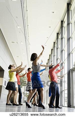 Business people dancing in office View Large Photo Image Stock Photography - Business people dancing in office. Fotosearch