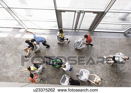 Business people playing in new office View Large Photo Image Stock Image - Business people playing in new office. Fotosearch