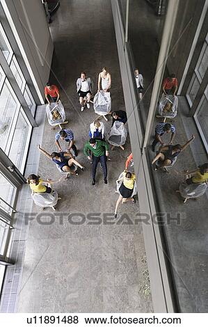 Business people playing in new office View Large Photo Image Stock Photo - Business people playing in new office. Fotosearch