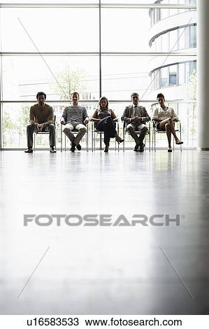 Business people sitting by window View Large Photo Image Stock Image - Business people sitting by window. Fotosearch