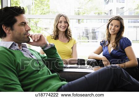 Business people sitting in office View Large Photo Image Stock Image - Business people sitting in office. Fotosearch